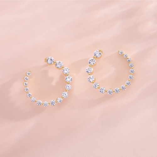 Diamond Hoop Earrings Elegantly Displayed on a Soft Pink Surface